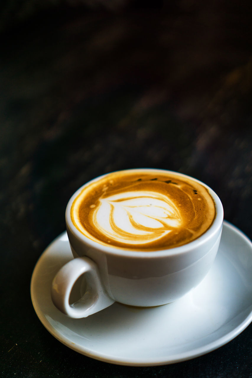 CLOSE-UP OF COFFEE CUP ON TABLE