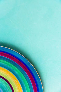 Cropped image of multi colored plate on table