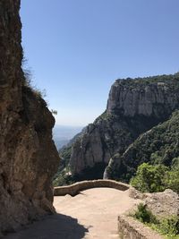 Scenic view of rock formation against clear blue sky