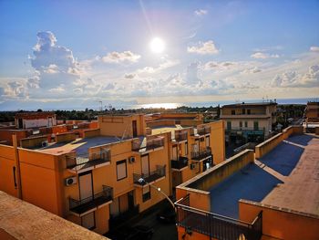 High angle view of townscape against sky on sunny day