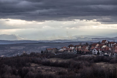 Houses and townscape against sky