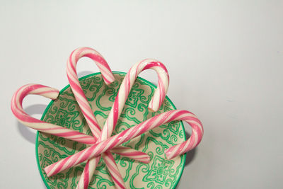 Close-up of heart shape over pink background
