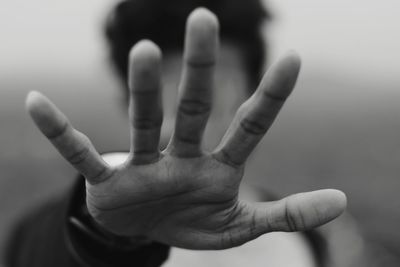 Young man showing stop gesture