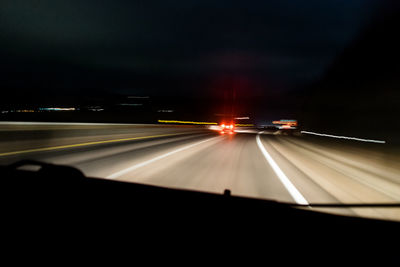 Light trails on road at night