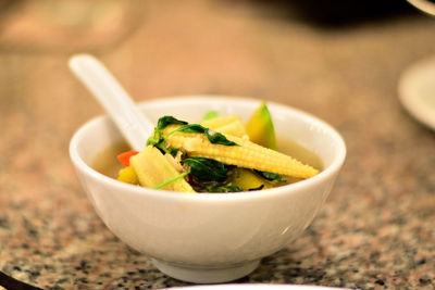 Close-up of baby corn soup on table