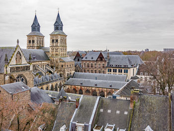 Panoramic view of buildings in city against sky