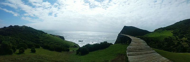 Panoramic view of sea against cloudy sky