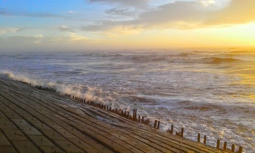 Scenic view of sea against sky during sunset