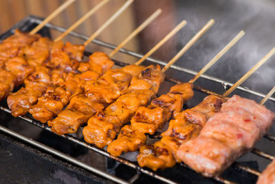 Close-up of meat on barbecue grill