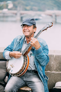 Portrait of a man playing guitar