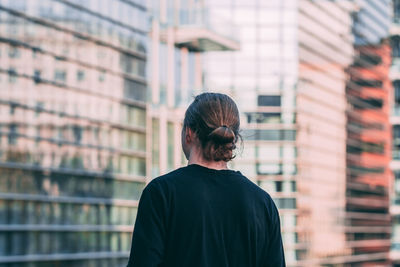 Rear view of man in city