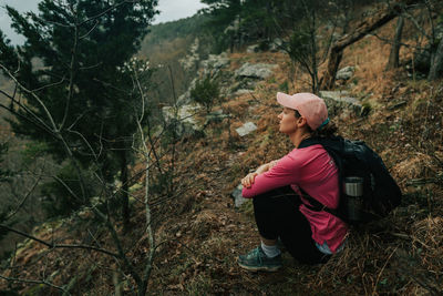 Woman looking at camera in forest