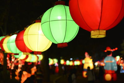 Close-up of illuminated multi colored lanterns