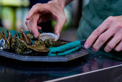 Close-up of man preparing food