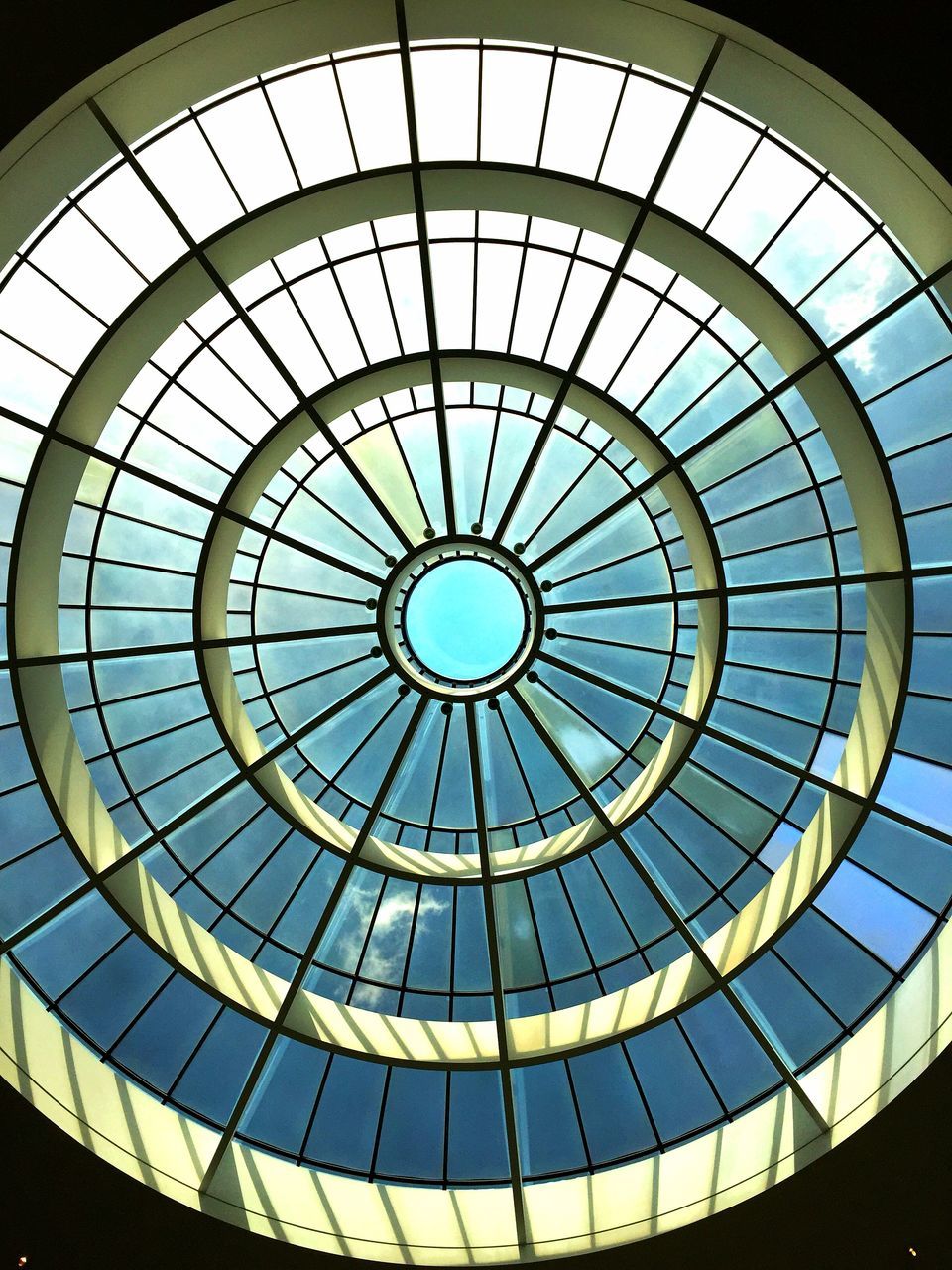 architecture, built structure, pattern, geometric shape, shape, circle, indoors, skylight, low angle view, ceiling, design, dome, no people, glass - material, sunlight, day, architectural feature, architecture and art, directly below, cupola, glass, ornate