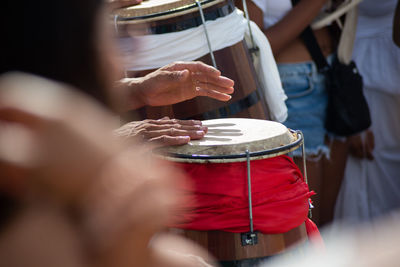 Percussionist hands playing atabaque.