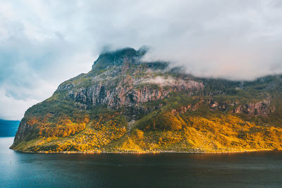 Aerial view of mountain by sea