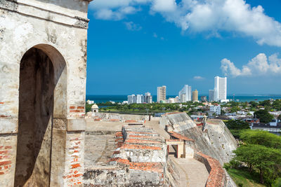 San felipe de barajas castle by city against sky