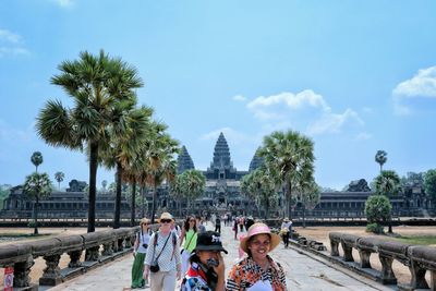 Tourists walking on city street