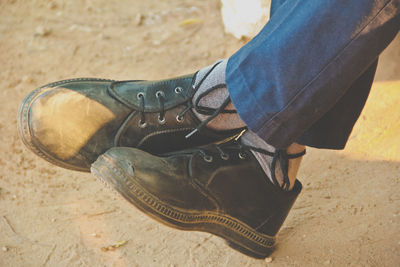 Low section of woman standing on tiled floor