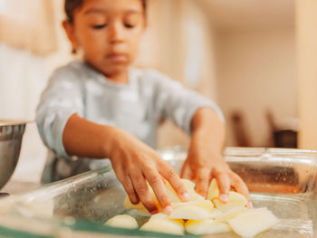 Cute girl preparing food at home