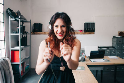 Portrait of smiling young woman with headphones