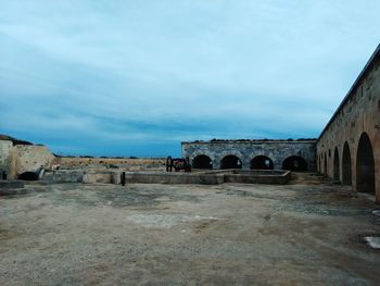 View of historic building against cloudy sky