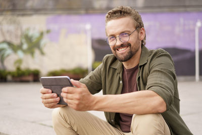 Young man using mobile phone