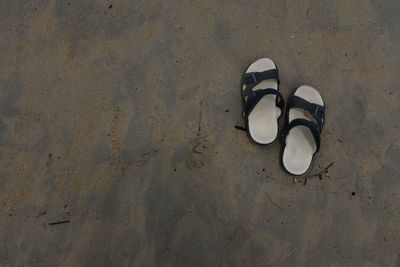 High angle view of sandals at beach 