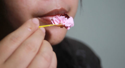 Close-up of hand holding ice cream