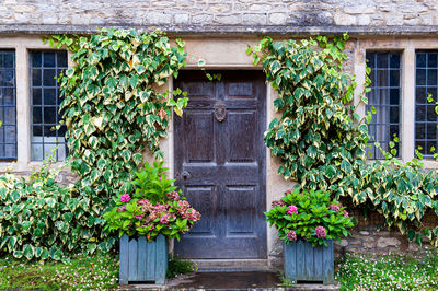 Doorway in castle combe, quaint village with well preserved masonry houses. cotswolds in england, uk