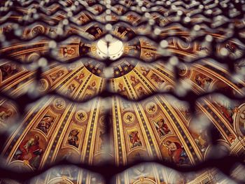 Low angle view of carvings on ceiling