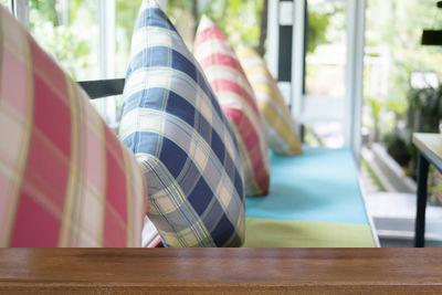 Close-up of multi colored umbrellas on table