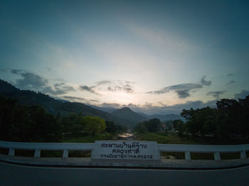 Text on mountains against sky