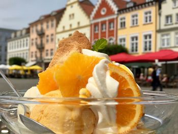 Close-up of orange slice in glass building