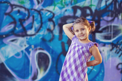 Portrait of smiling girl playing outdoors