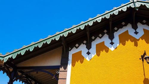 Low angle view of building against blue sky