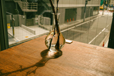 High angle view of glass bottles on table at restaurant