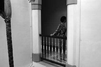 Woman standing in corridor