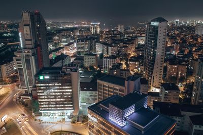 High angle view of illuminated buildings in city at night