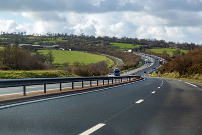 High angle view of vehicles on road against sky