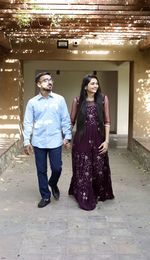 Portrait of young couple standing outdoors