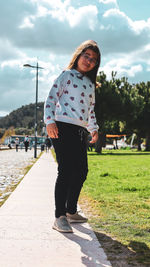 Portrait of girl standing on field