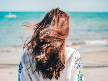 Rear view of woman looking at sea