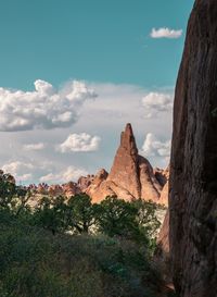 Rock formations on landscape against sky