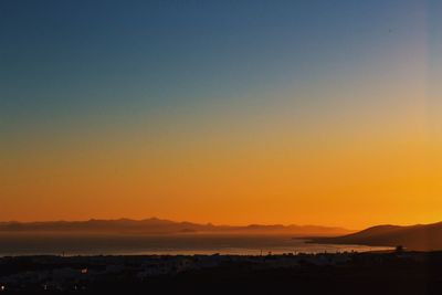 Scenic view of mountains at sunset