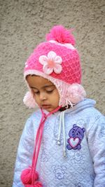 Portrait of cute girl with pink hat