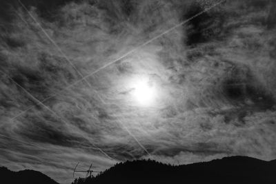 Low angle view of vapor trails in sky