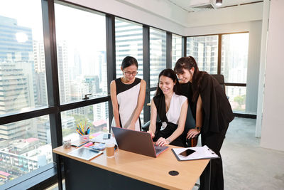 People working on table at home