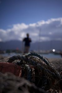 Close-up of fishing net on beach